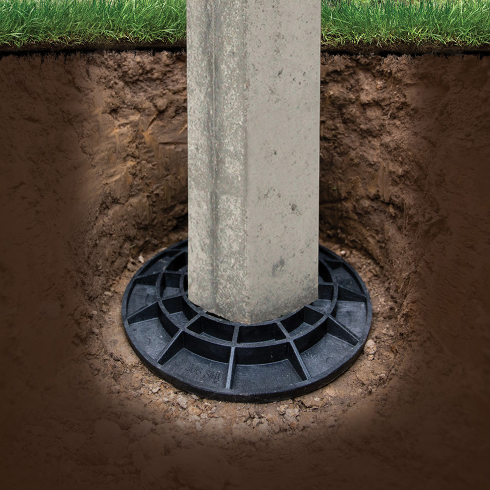 A perma post using a FootingPad as a foundation in a hole in the ground